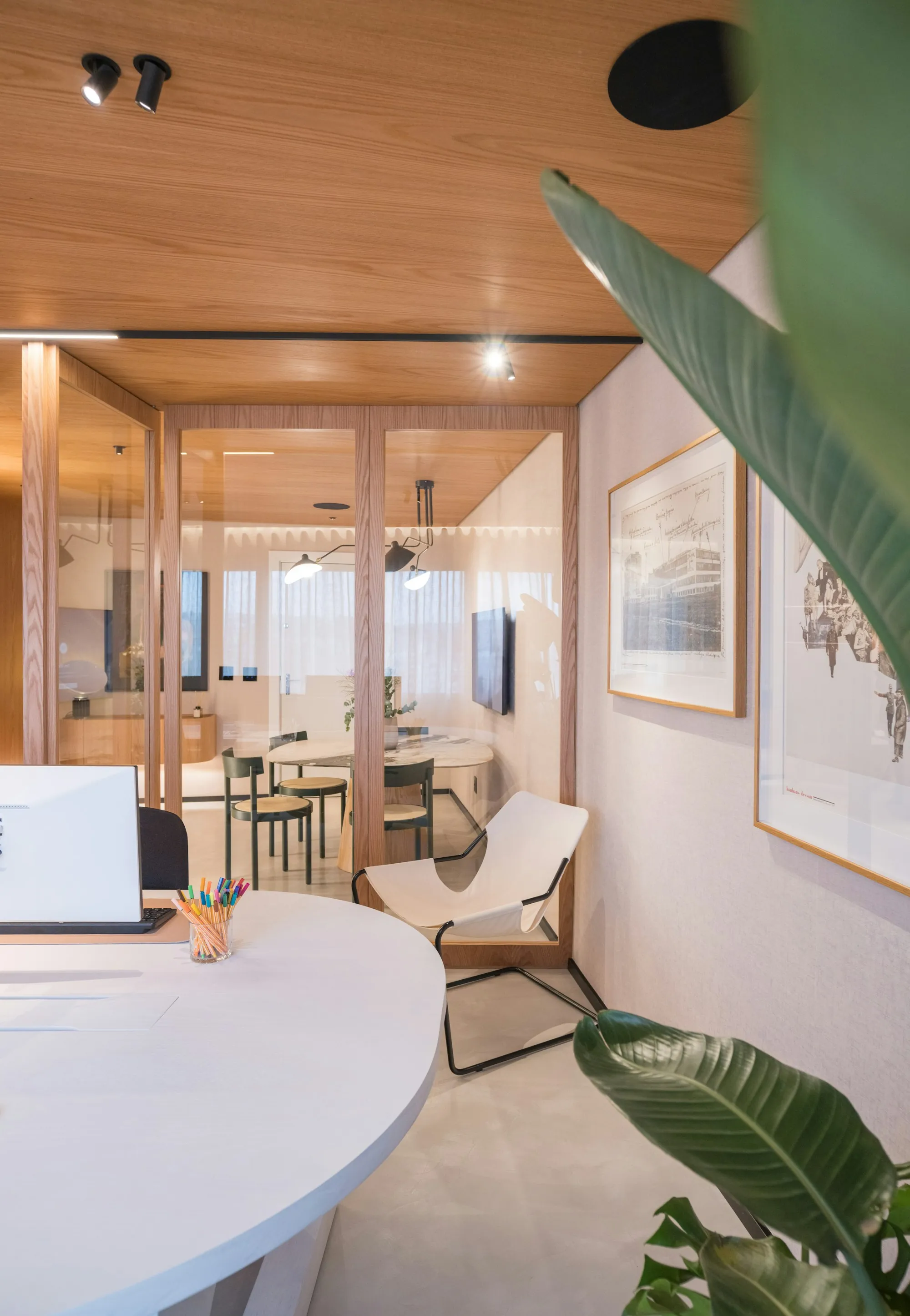 Glass-fronted office suite with a small meeting area